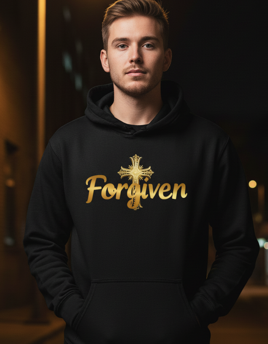 Man wearing a black hoodie with 'Forgiven' in gold text against a dark background