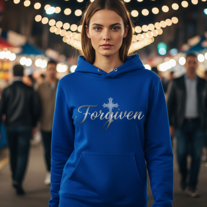 Person wearing a blue hoodie with 'Forgiven' text in an outdoor night market setting