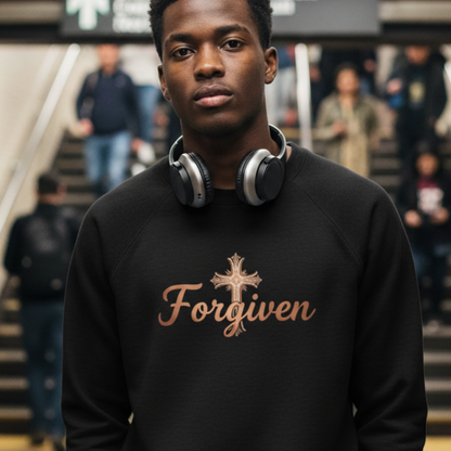 Person wearing a black sweatshirt with 'Forgiven' text in a subway setting
