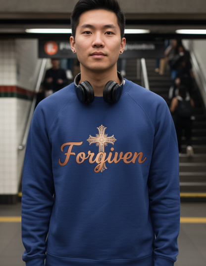 Person wearing a blue sweatshirt with 'Forgiven' text in a subway setting