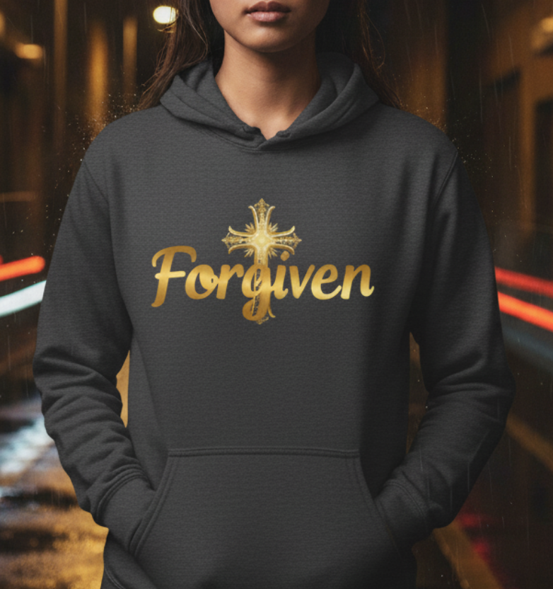 Person wearing a hoodie with 'Forgiven' text on a dark, possibly urban street.