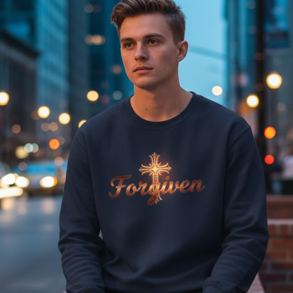 Man sitting on a brick wall in an urban setting wearing a sweatshirt with 'Forgiven' text.