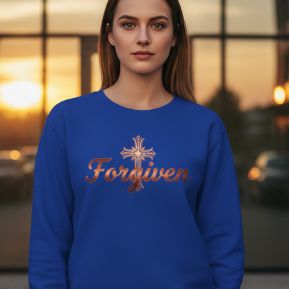 Woman wearing a blue sweatshirt with 'Forgiven' and a cross design, standing in an urban setting.