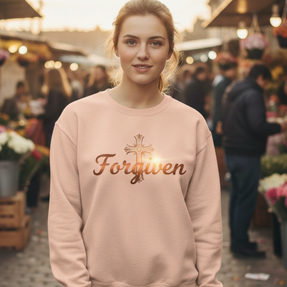 Woman wearing a pink sweatshirt with 'Forgiven' text at an outdoor market.
